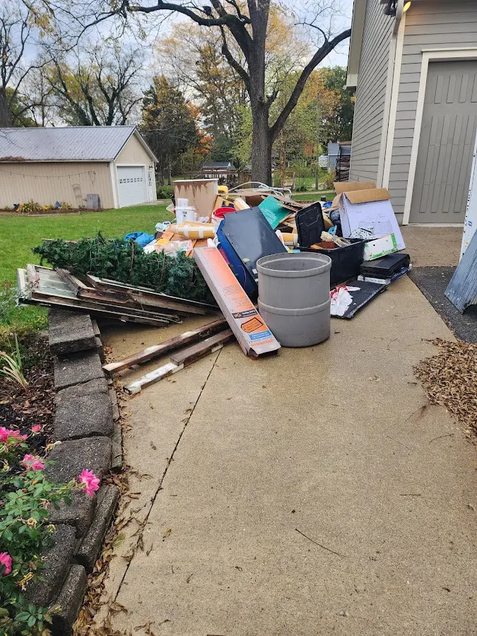 Dumpster being loaded with debris for 30 Yard Dumpster Rental in North Kansas City